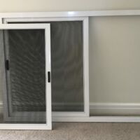 Sliding fly screen panels Sliding fly screen panel removed from its outer frame