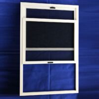 Vertical Sliding Fly Screen White vertical sliding fly screen frame with the lower panel raised
