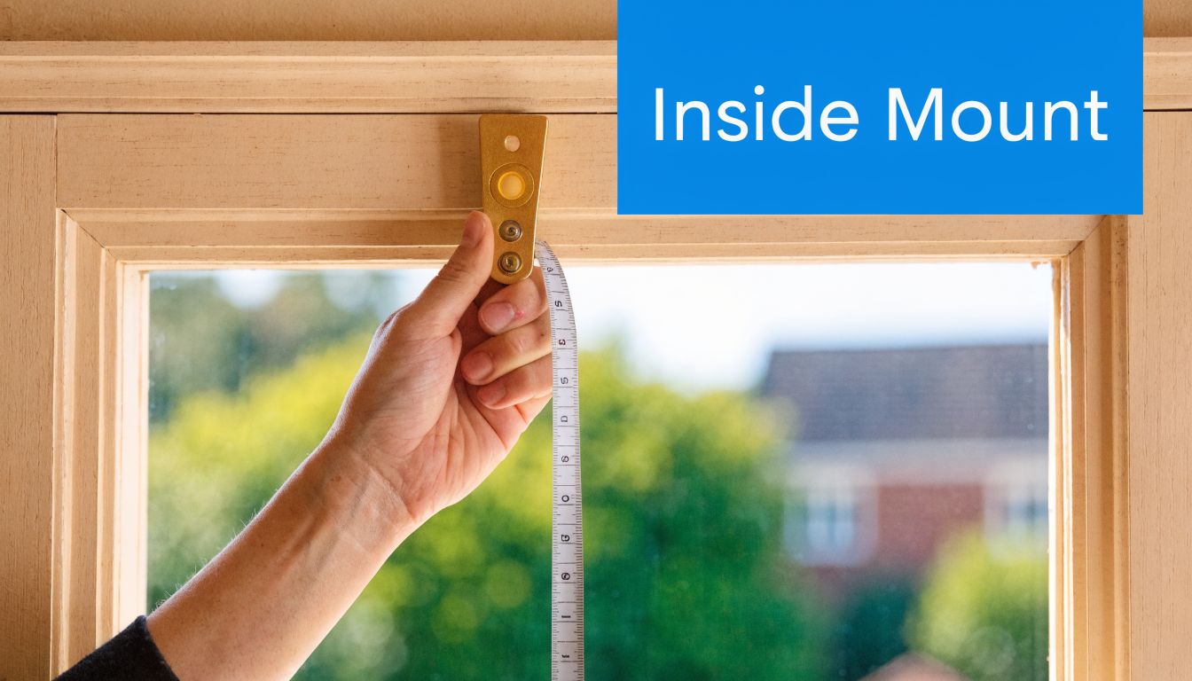 A close-up view of a person using a measuring tape to measure the inside of a window frame.